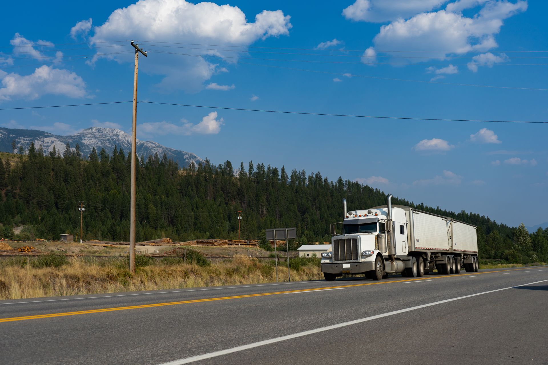 Truck moving freight through mountain terrain